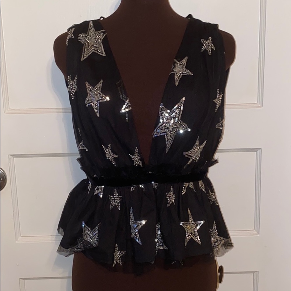 Plunge star embellished peplum